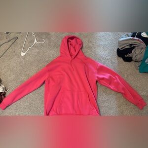 Neon pink hoodie.